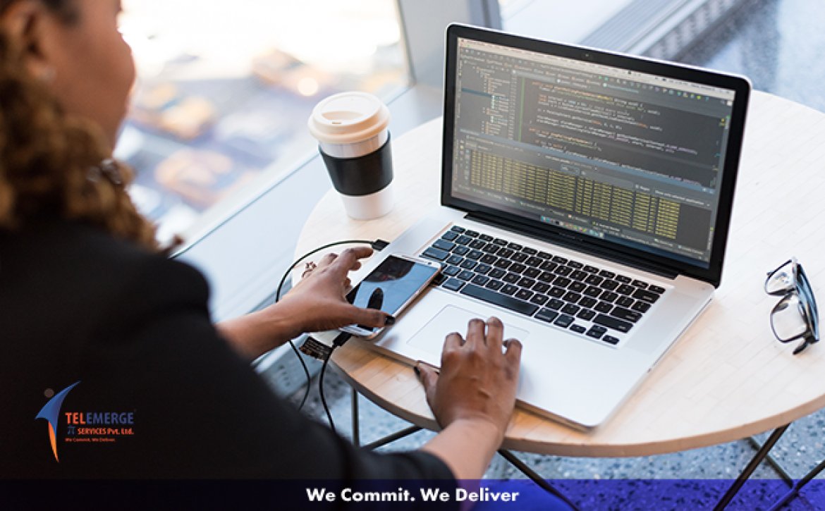 A programmer working on her computer