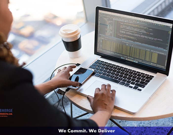 A programmer working on her computer